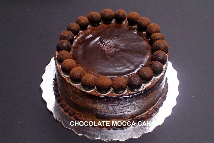 A chocolate mocca cake on a silver plate