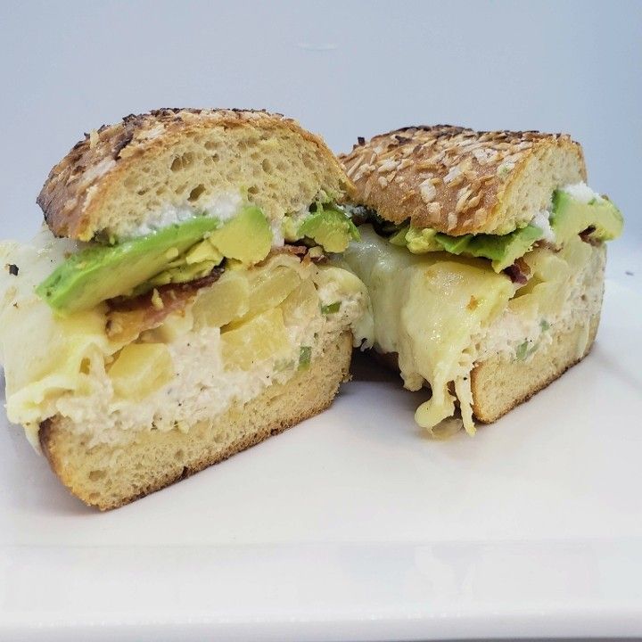 Two halves of a sandwich on a white plate