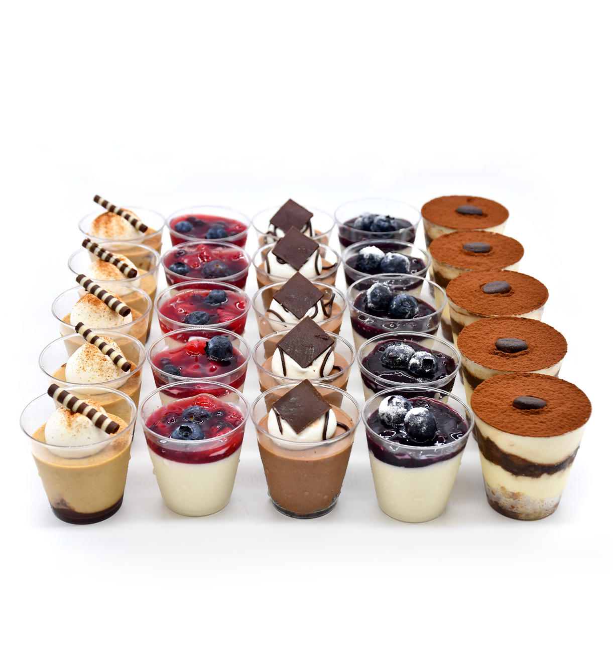 A variety of desserts in plastic cups on a table.