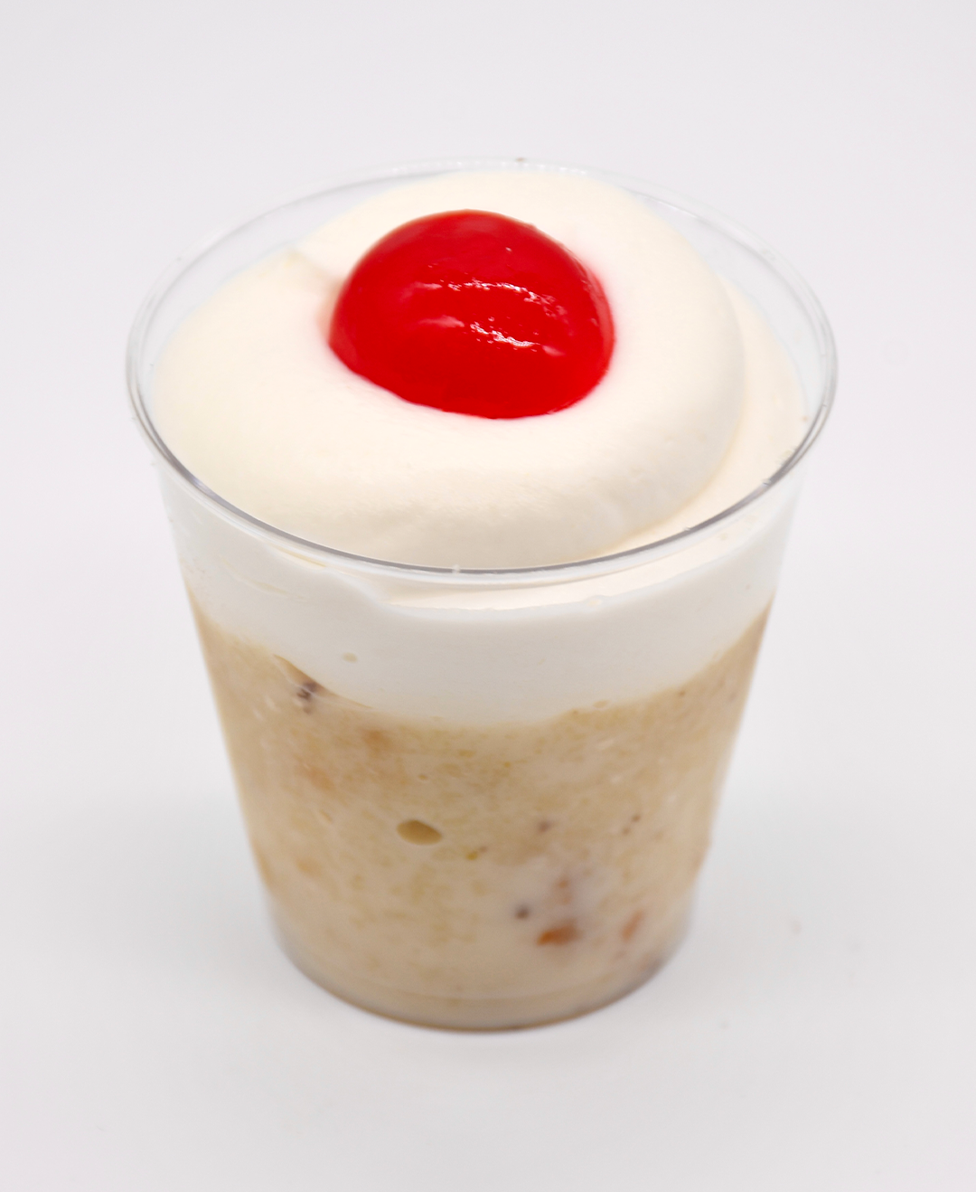 tres leches with whipped cream and a cherry on top
