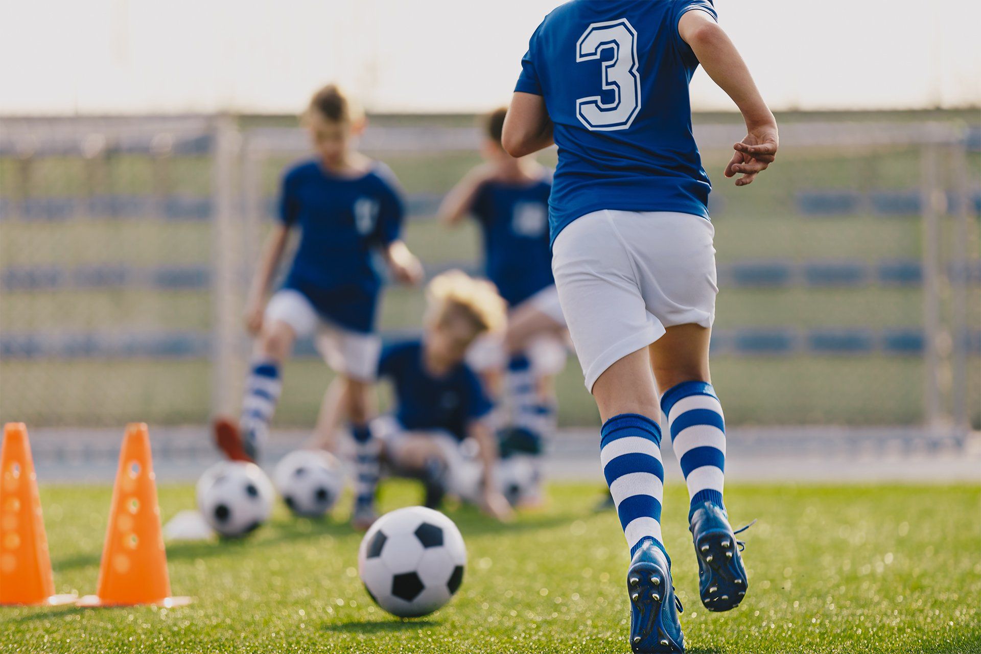 Teens Playing Soccer