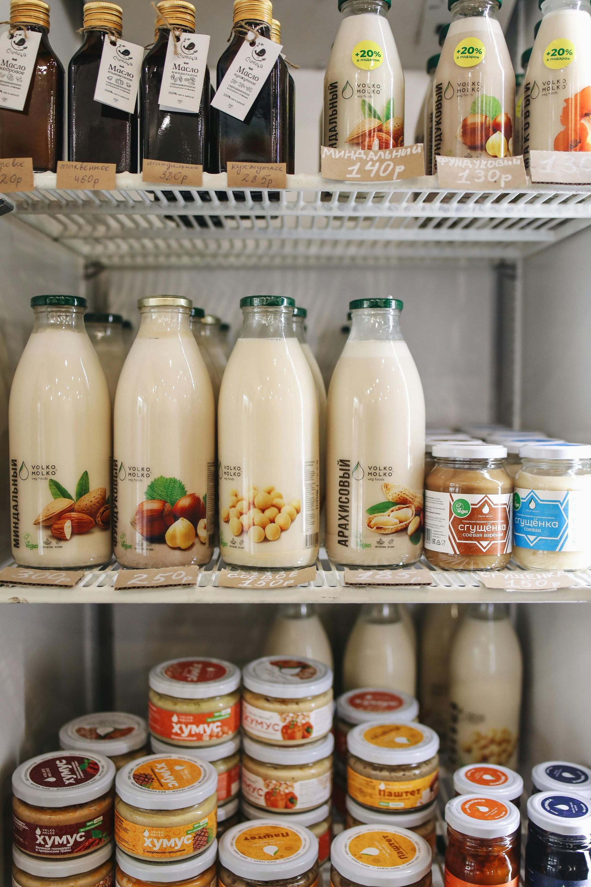 Milk bottles and jars inside a fridge after fridge repair Spanish Fork UT.