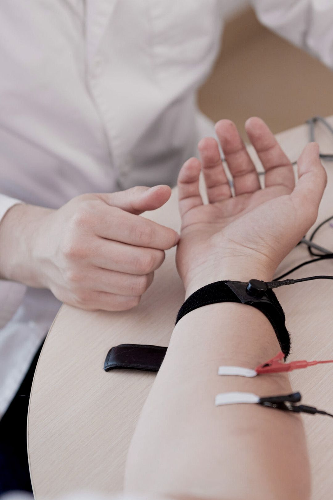 Person's arm with electrodes attached.