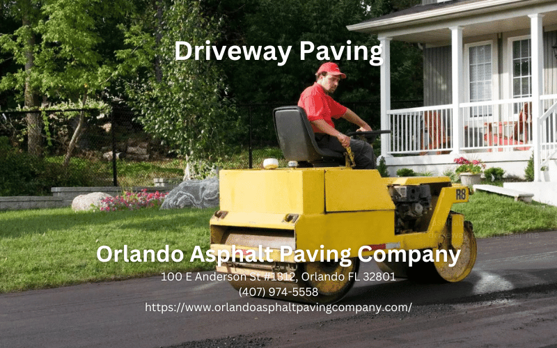 worker leveling fresh asphalt on a road construction