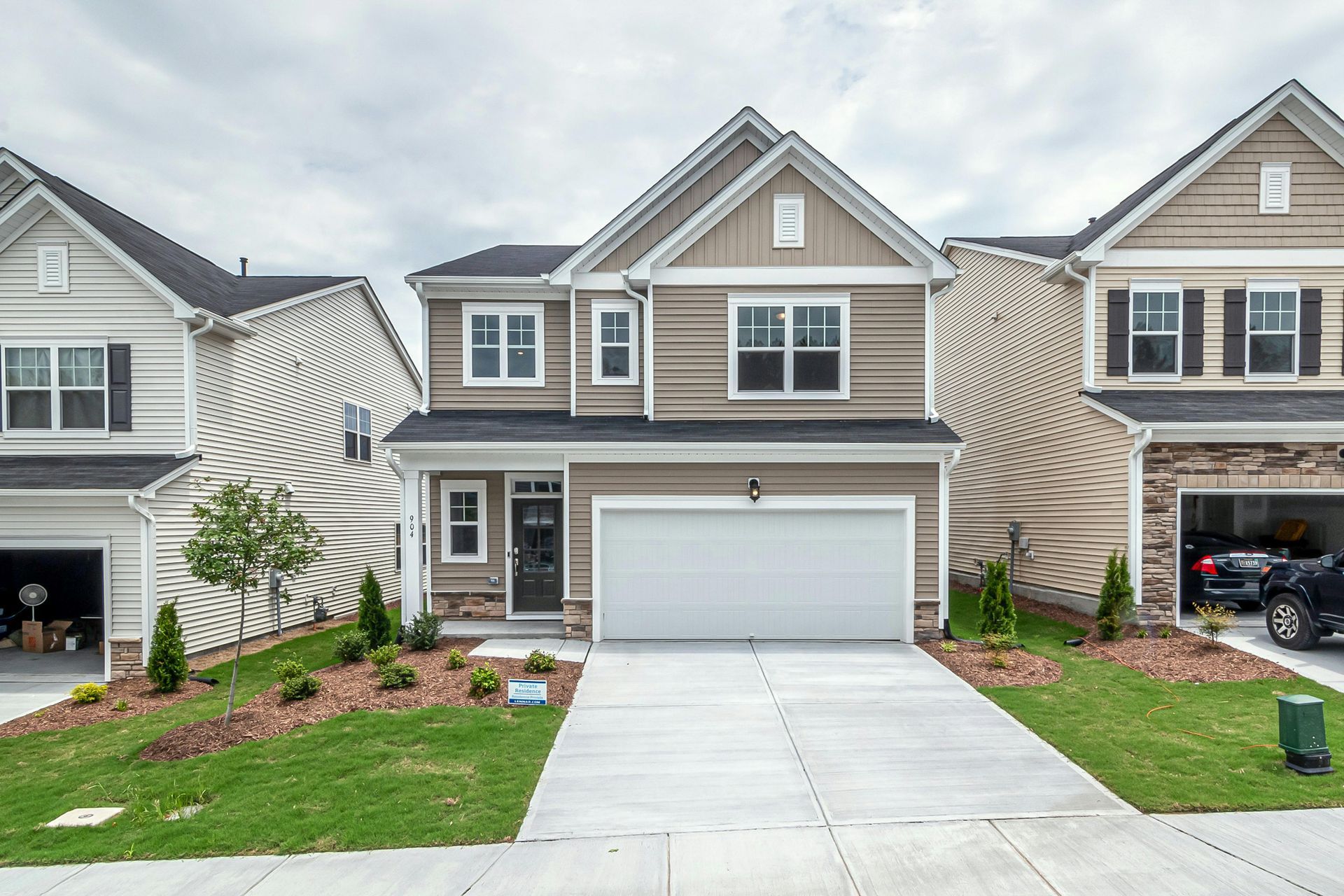 The front of a house with a white garage door