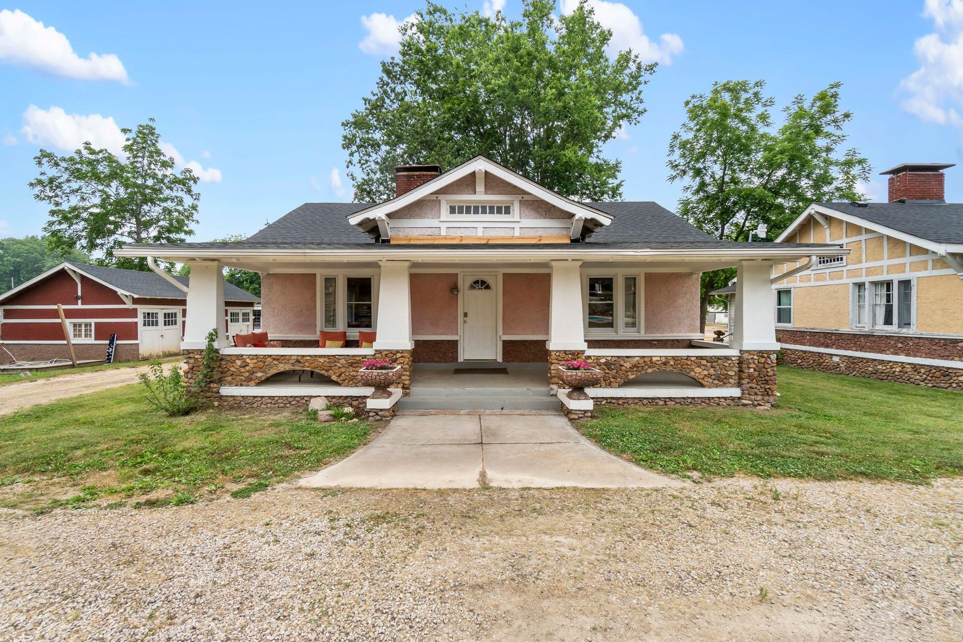 A house with a porch and a walkway leading to it