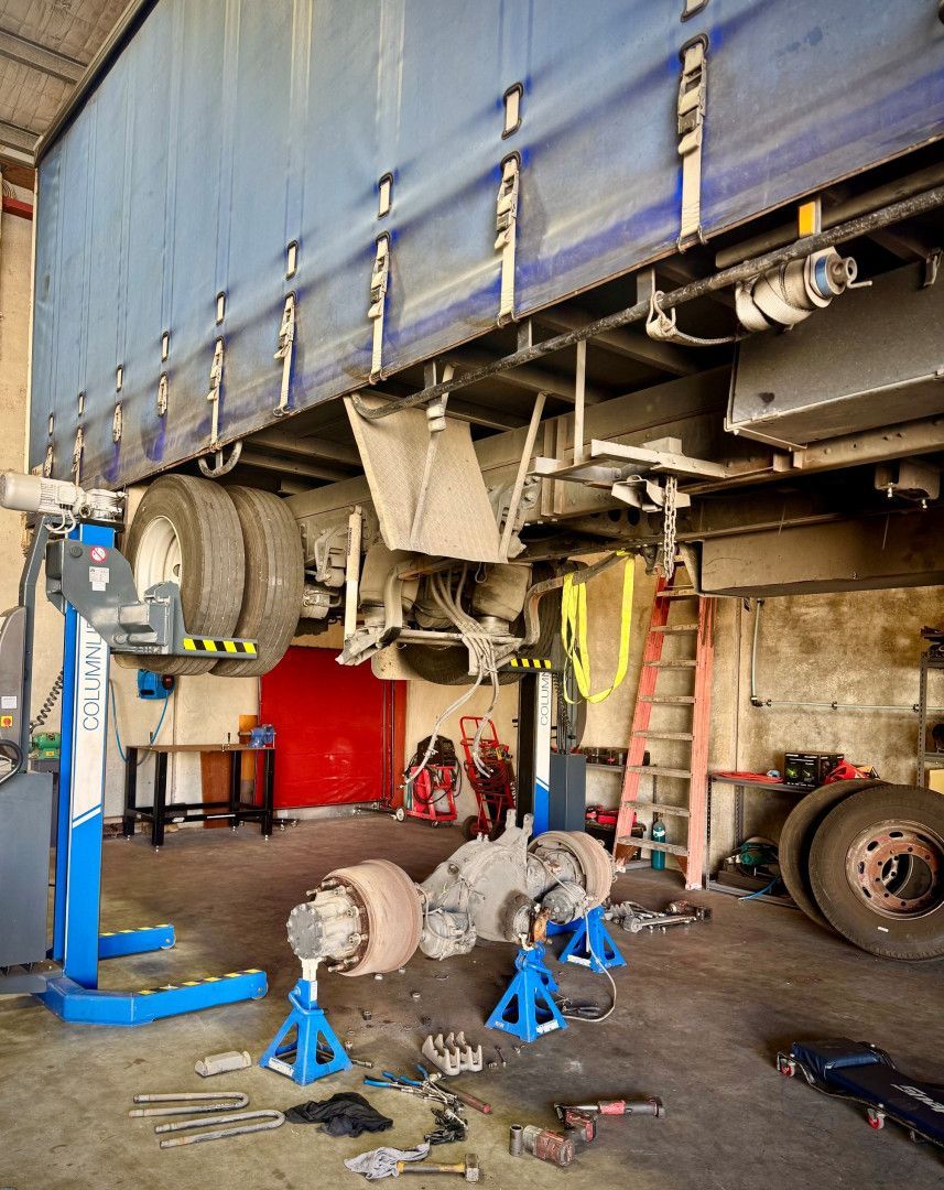 A Man is Working on the Engine of a Truck — Inline Truck and Plant in Tuggerah, NSW