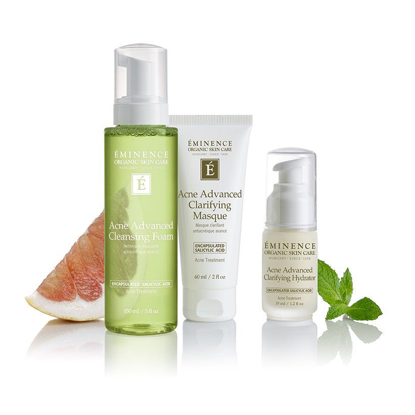 A bottle of foaming cleanser a bottle of clarifying masque and a bottle of serum