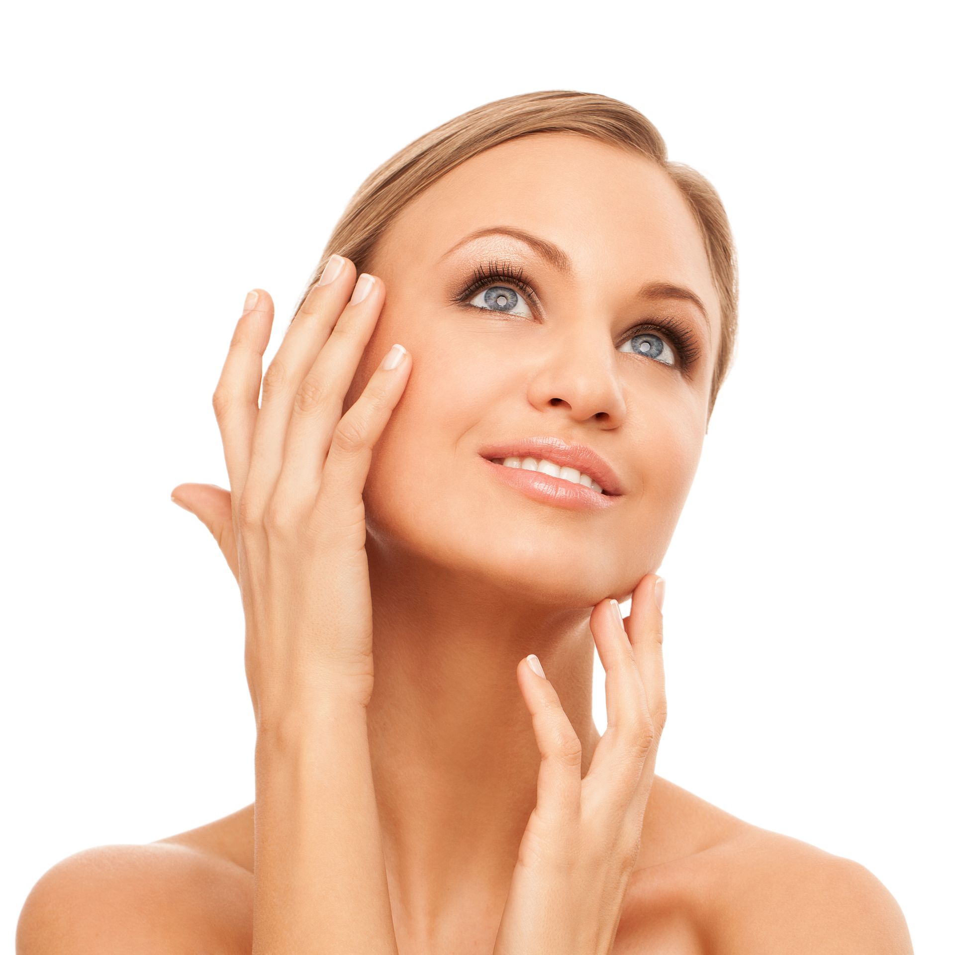 A woman is touching her face with her hands and smiling.