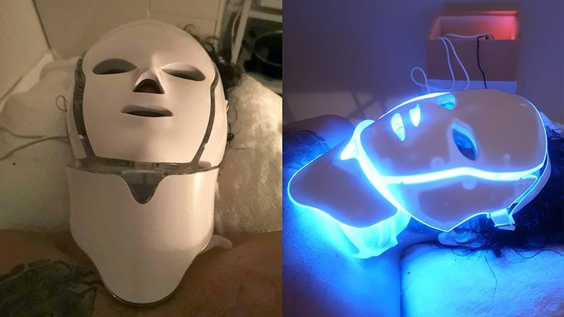 A person is wearing a light up mask on their face.