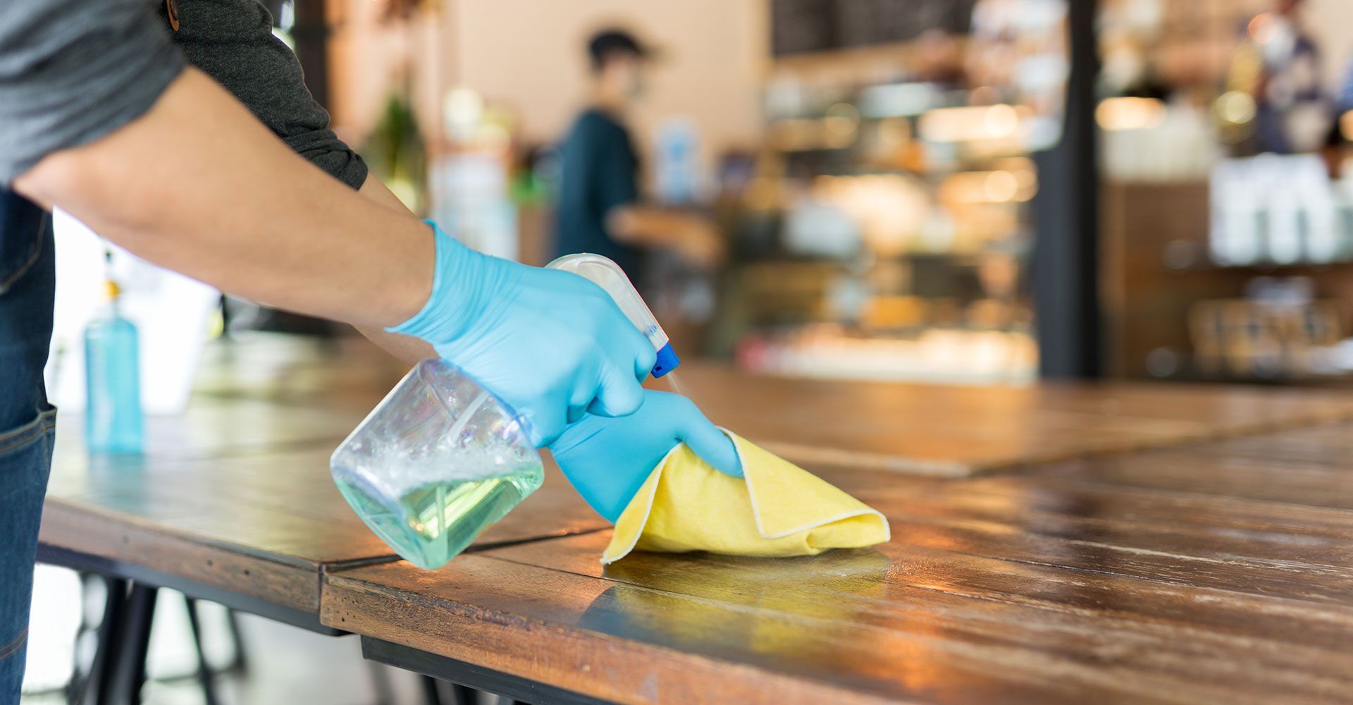 Spraying Disinfectant to the Table
