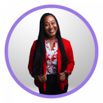 Woman smiling, wearing a red blazer, floral blouse, and black skirt.