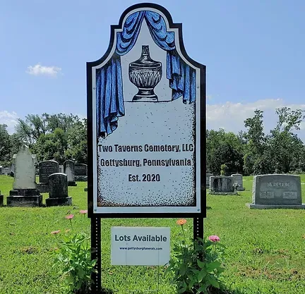 A sign in a cemetery that says lots available