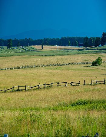 There is a fence in the middle of the field.