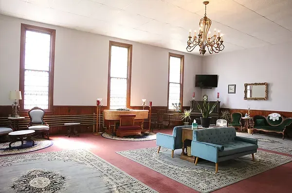 A living room filled with furniture and a piano.