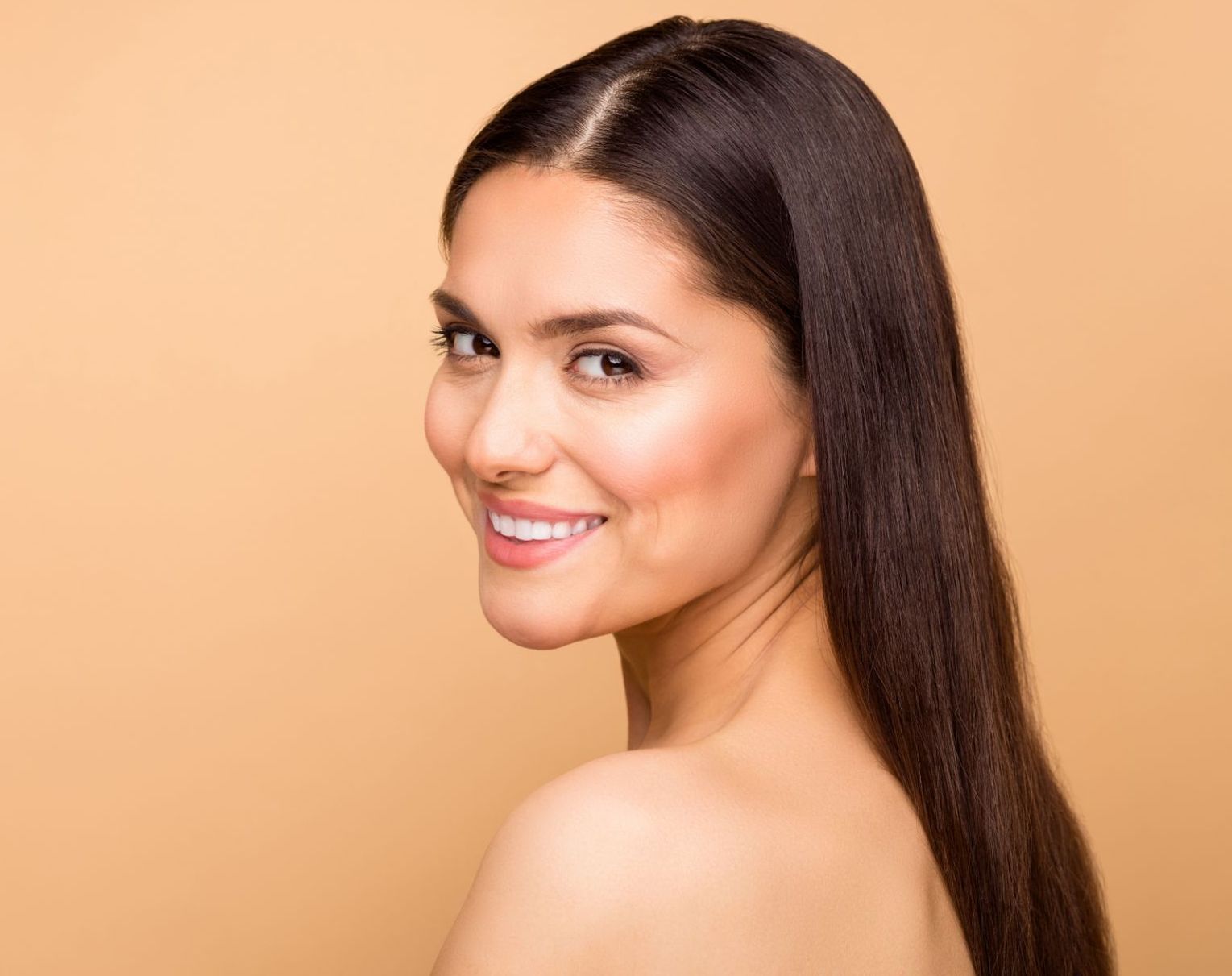 30-something woman with long dark hair