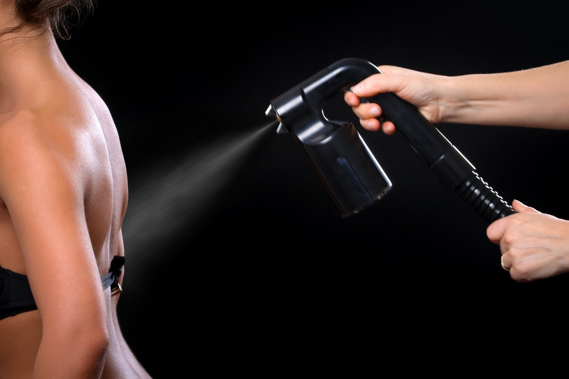 A Woman Is Receiving A Spray Tan For Her Back – Terrigal, NSW - Anjule Beauty Therapy