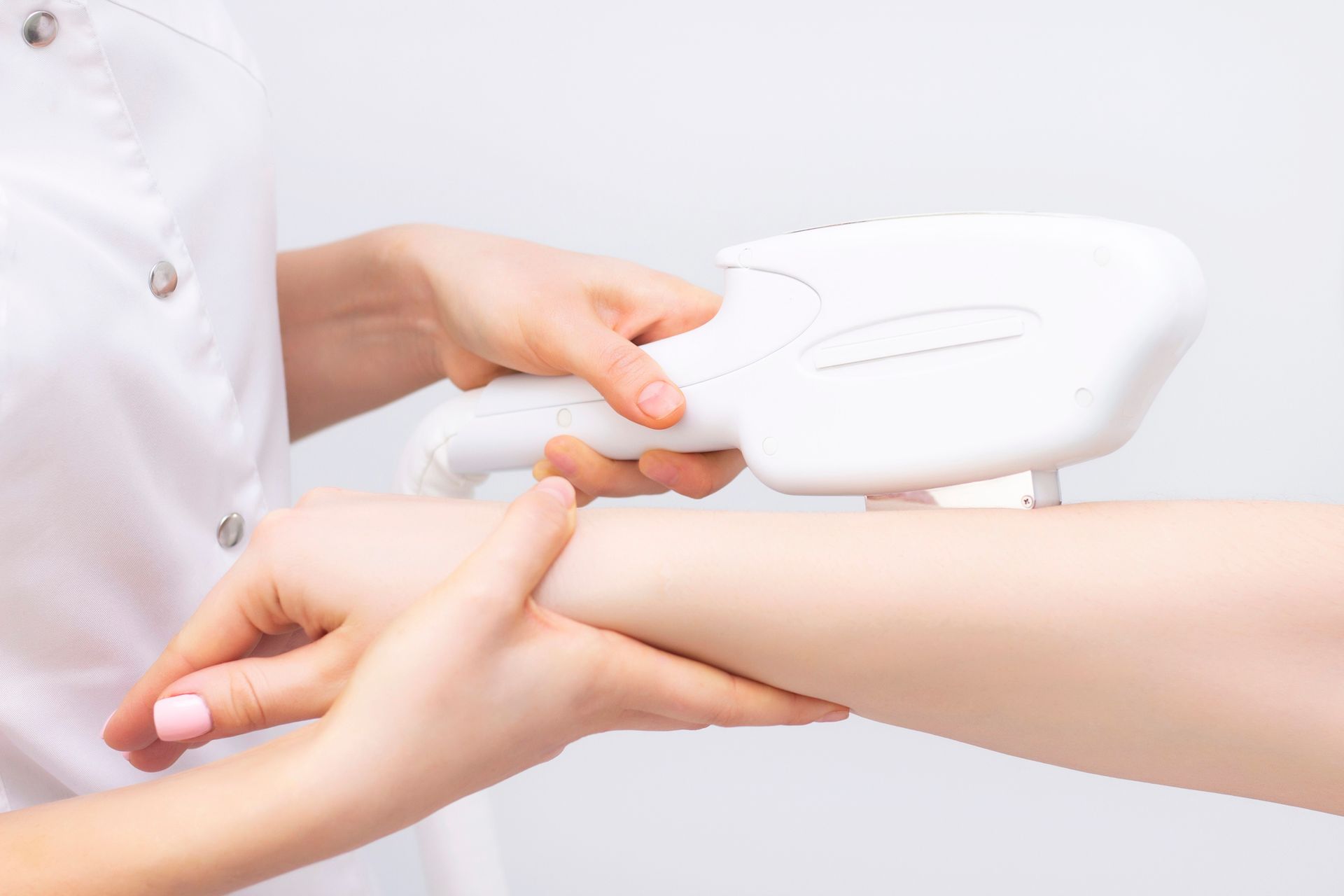 A Woman Is Getting A Laser Hair Removal Treatment On Her Arm – Terrigal, NSW - Anjule Beauty Therapy