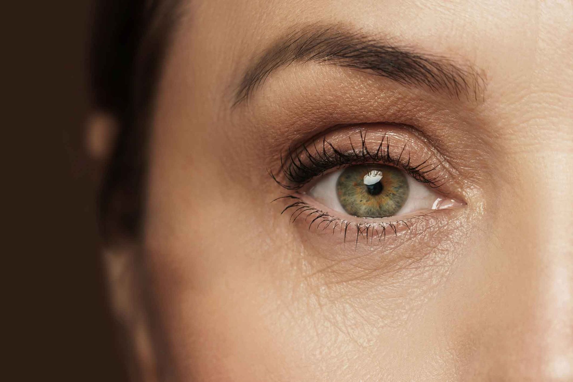A Close Up Of A Woman's Green Eye With Makeup On – Terrigal, NSW - Anjule Beauty Therapy