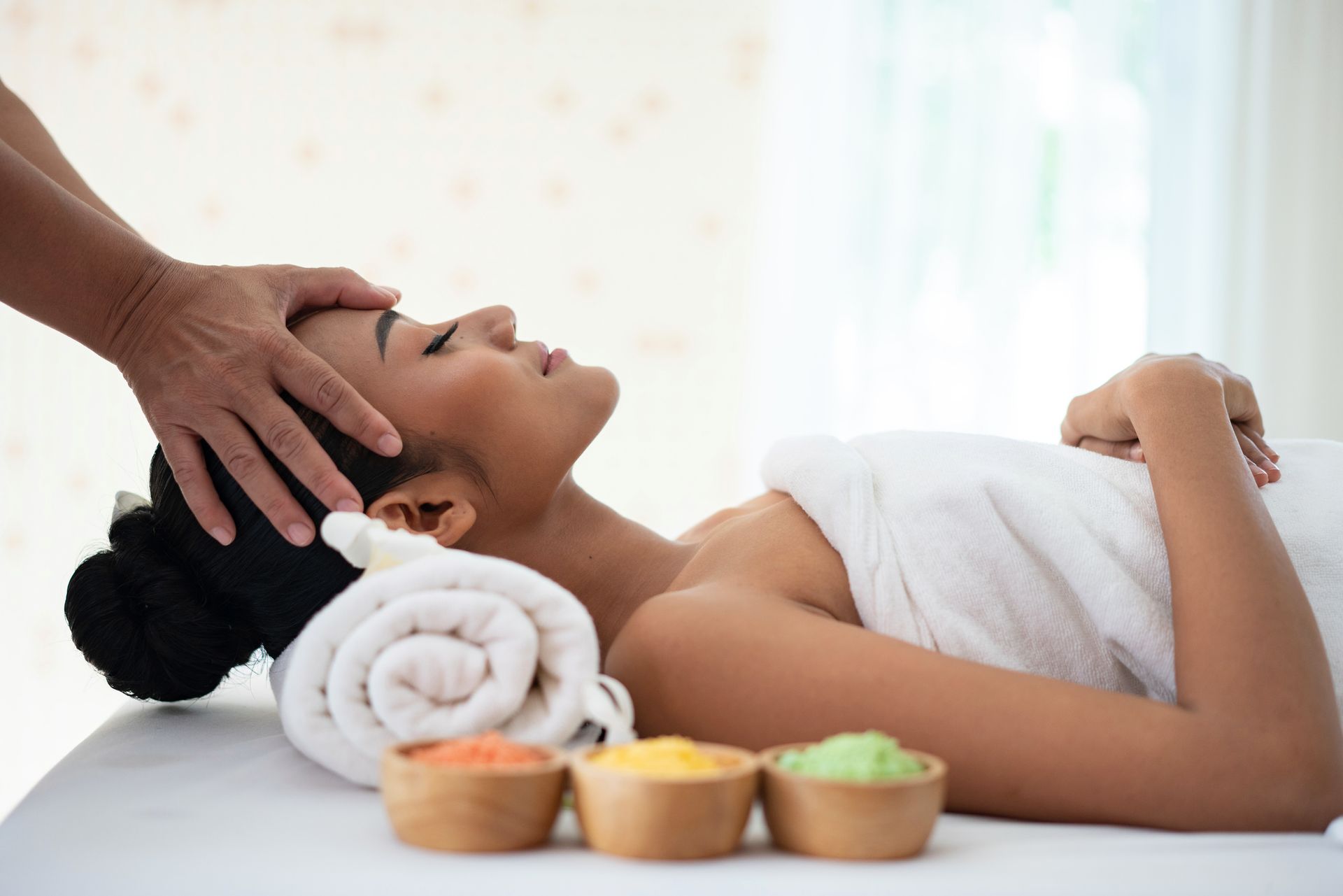 A Woman Is Wearing A Sheet Mask On Her Face – Terrigal, NSW - Anjule Beauty Therapy