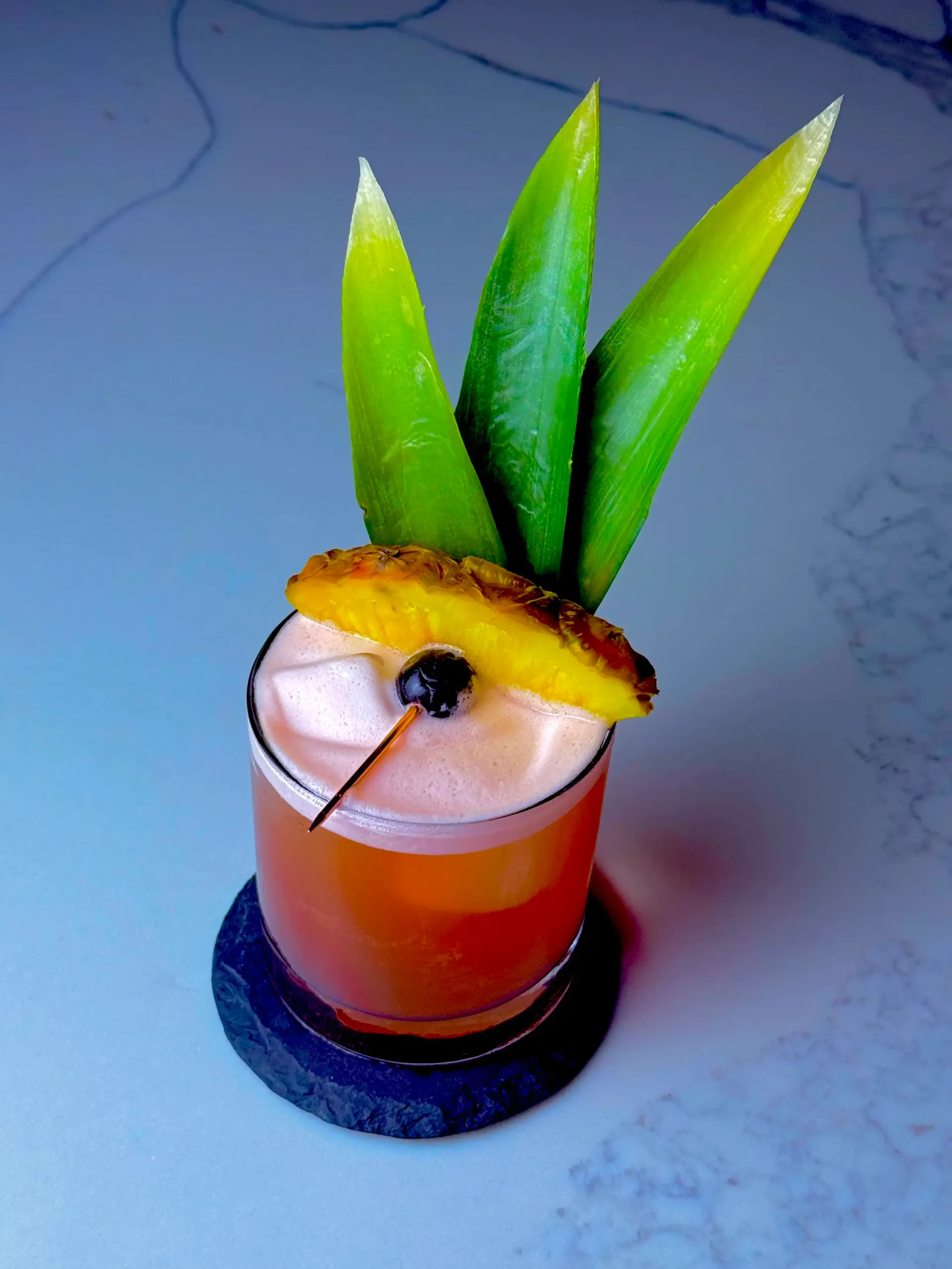 Lean Flamingo, a bittersweet tropical rum cocktail combining Campari, pineapple, and measured lime acidity