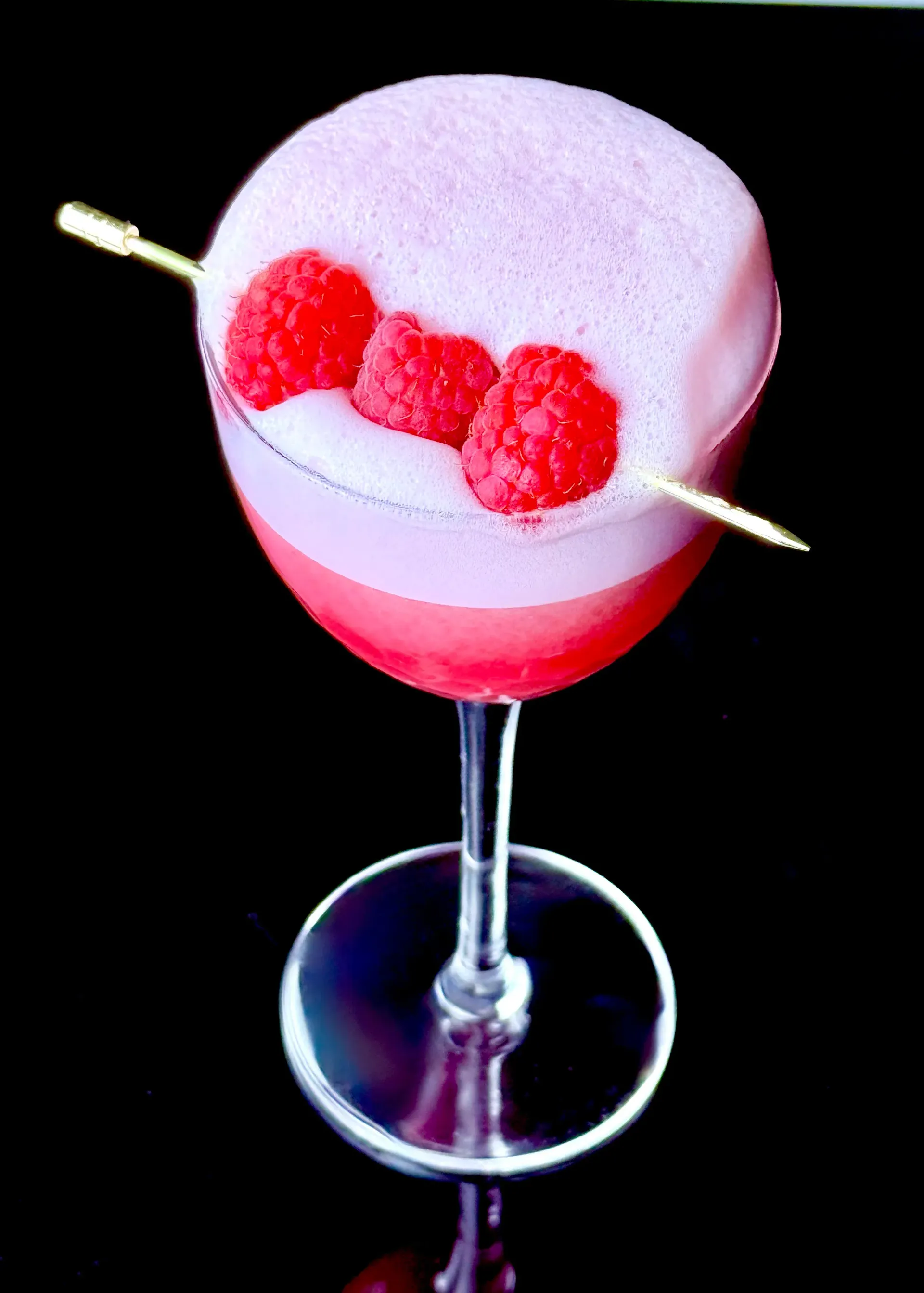 Clover Redux raspberry gin sour made with fresh raspberries, gin, Cordial Craft Zero-Sugar Lime Cordial, and egg-white foam