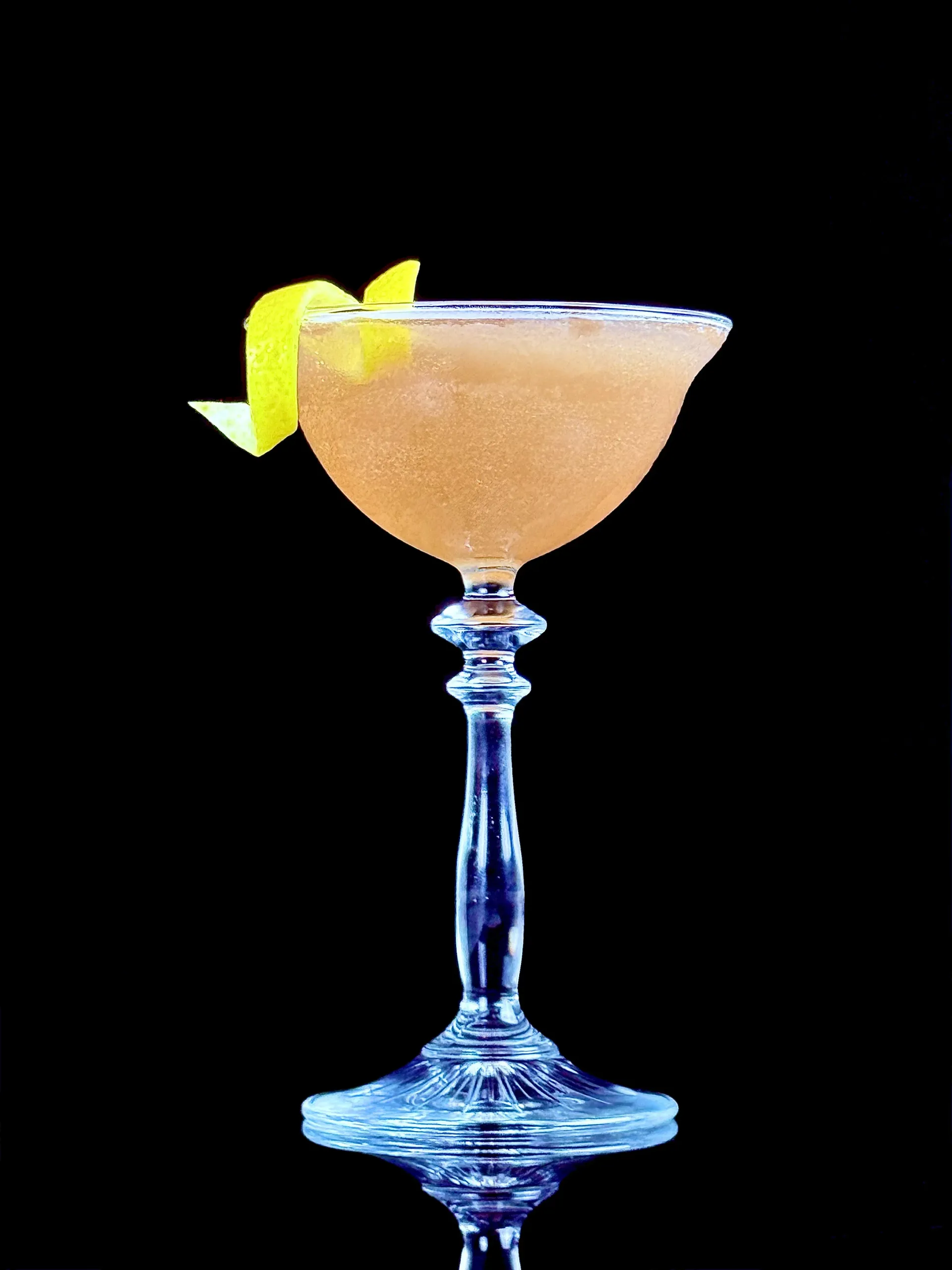 Skinny Cosmo, a lighter cosmopolitan-style build with citron vodka, orange liqueur, cranberry, and measured lime acidity