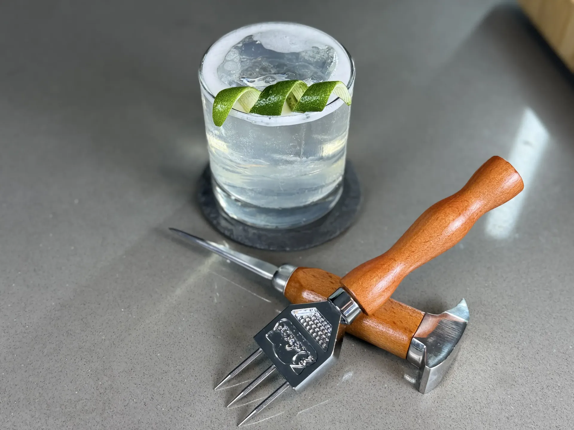 Finished Cordial Craft cocktail beside the bottle, illustrating how a measured ratio becomes a finished drink