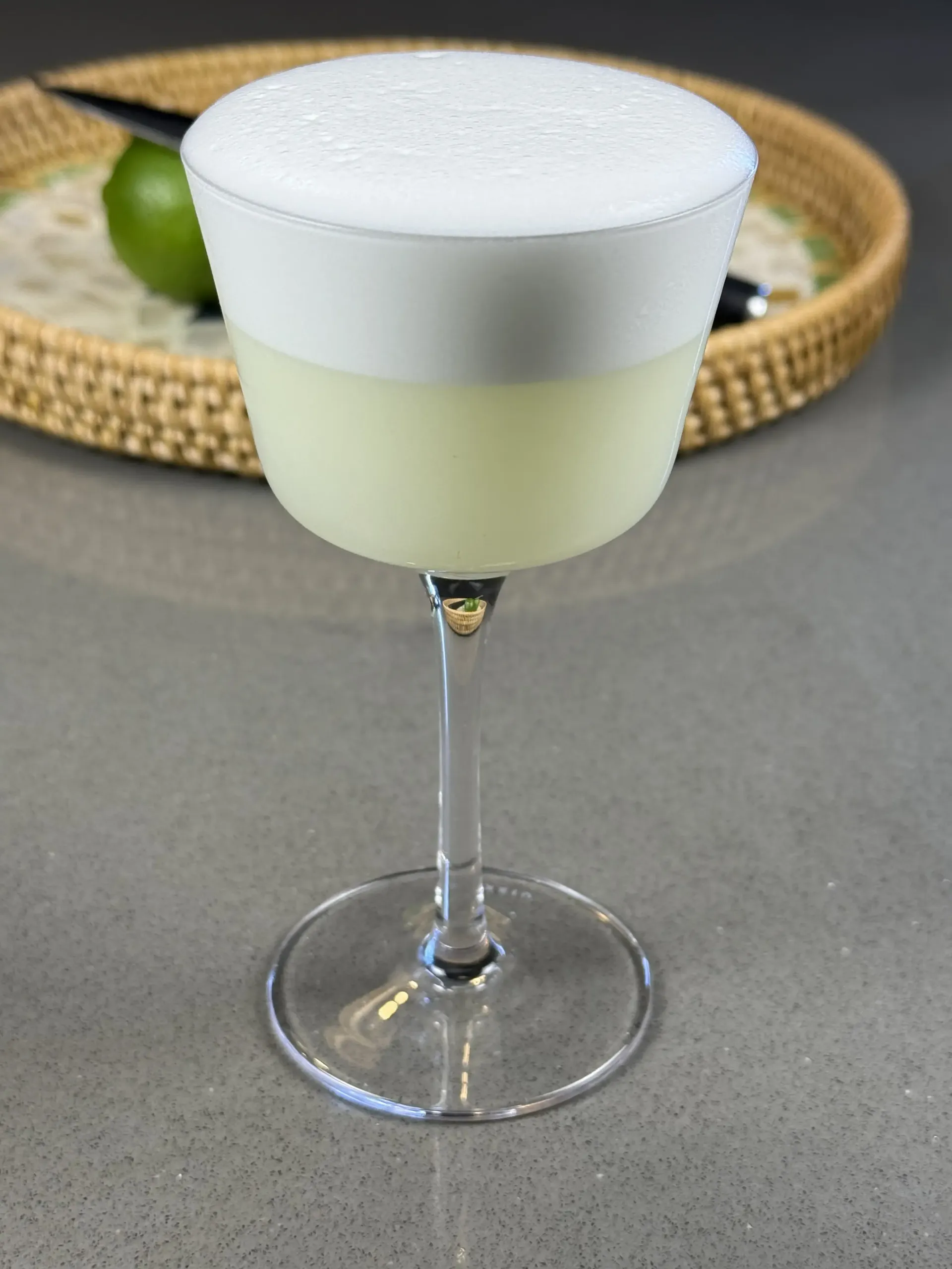 Skinny Pisco Sour with foam and aromatic bitters