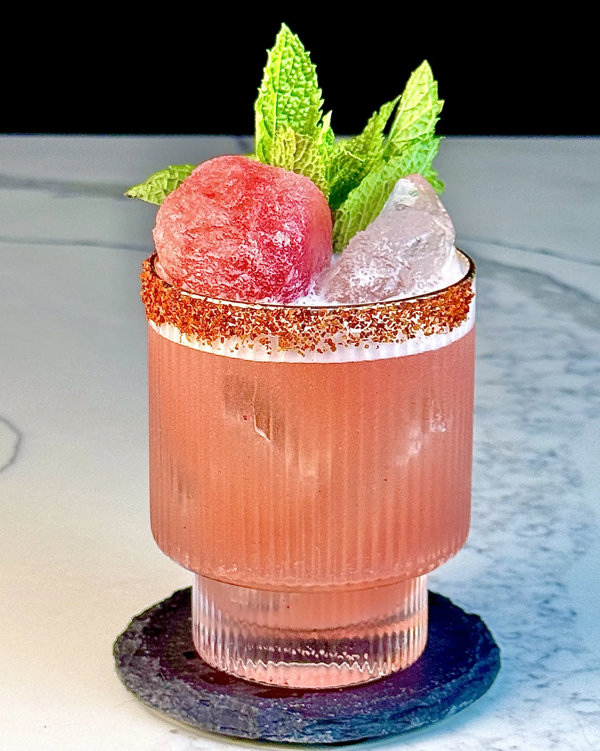 Slim Slice, a watermelon margarita shaken with a frozen watermelon rock for fruit flavor and gradual dilution