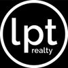 A blue realtor logo on a white background