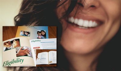 Woman smiling widely; brochures on eligibility visible.
