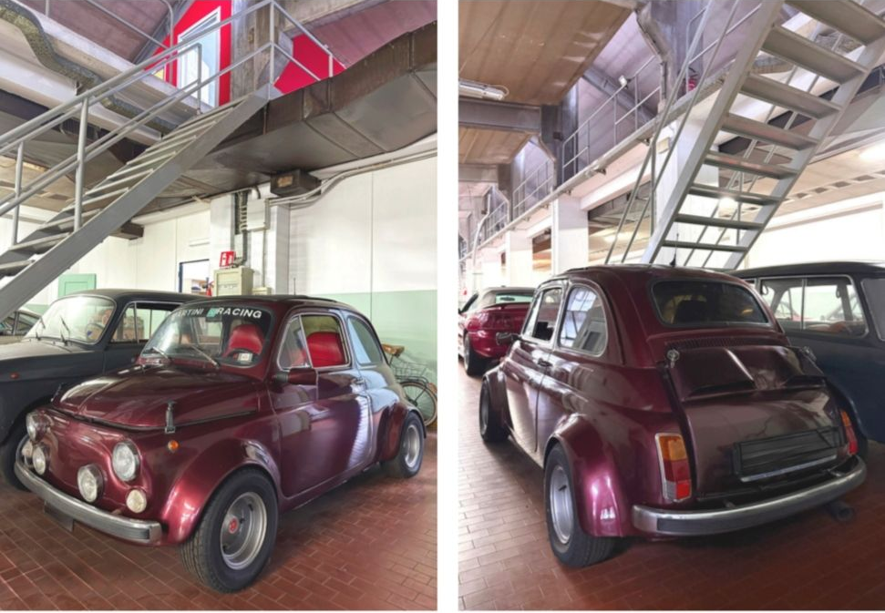 Classica auto d'epoca color bordeaux parcheggiata al chiuso sotto una scala metallica, ripresa da diverse angolazioni: frontale e posteriore.