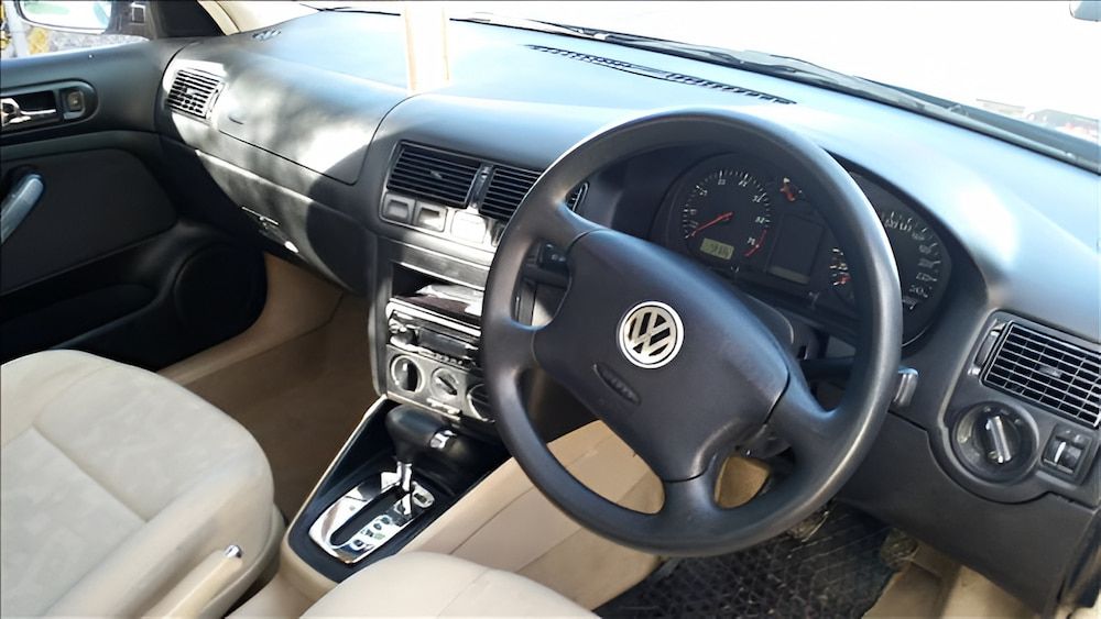 Interior View of a Black and Beige Volkswagen Car Dashboard — Crypto Parts In  Tuggerah, NSW
