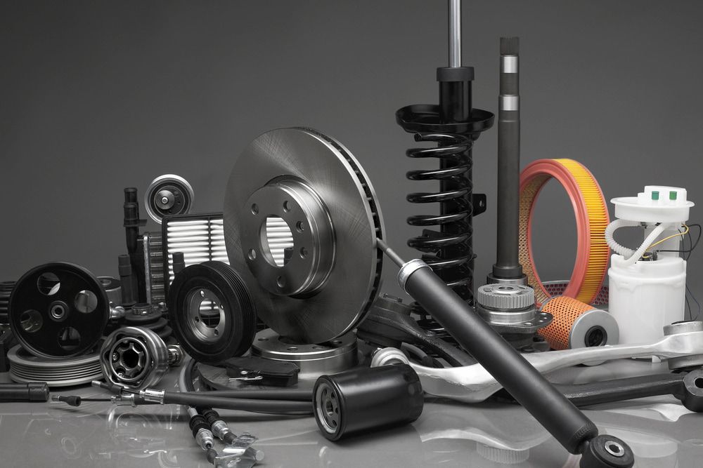 Various Car Parts, Including a Brake Rotor, Shock Absorber, and Belt — Crypto Parts In Tuggerah, NSW