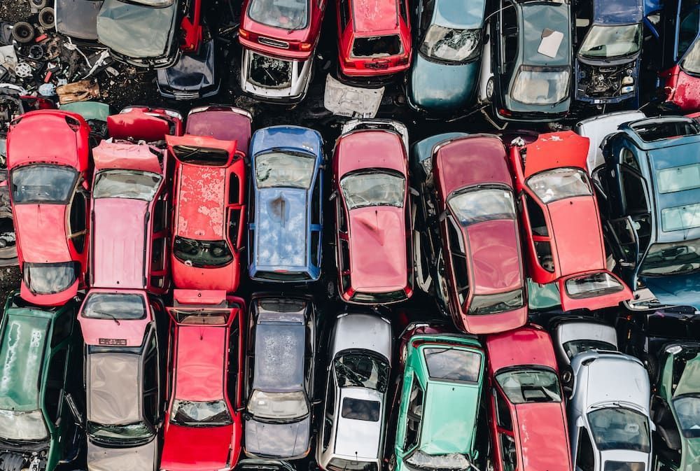 Overhead View of a Junkyard Filled With Rows of Colourful, Wrecked Cars — Crypto Parts In Tuggerah, NSW
