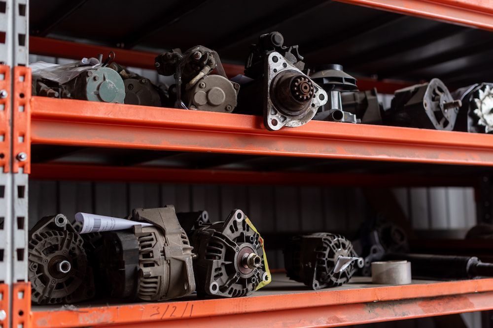 Car Parts Stored on Orange Metal Shelves — Crypto Parts In  Tuggerah, NSW
