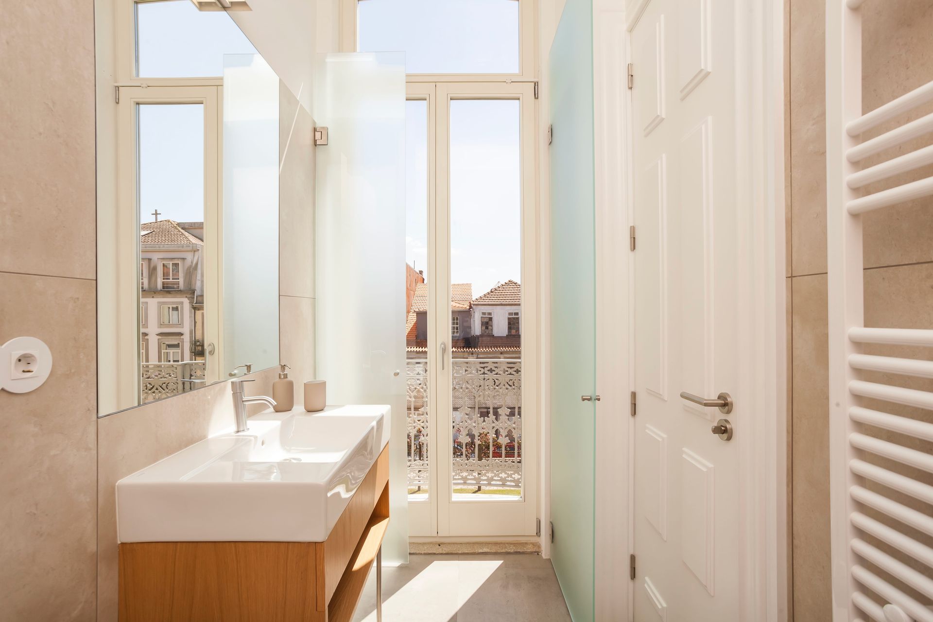 Interior of Casa Kala Boutique Guesthouse. Private modern bathroom with large mirror and walk-in shower