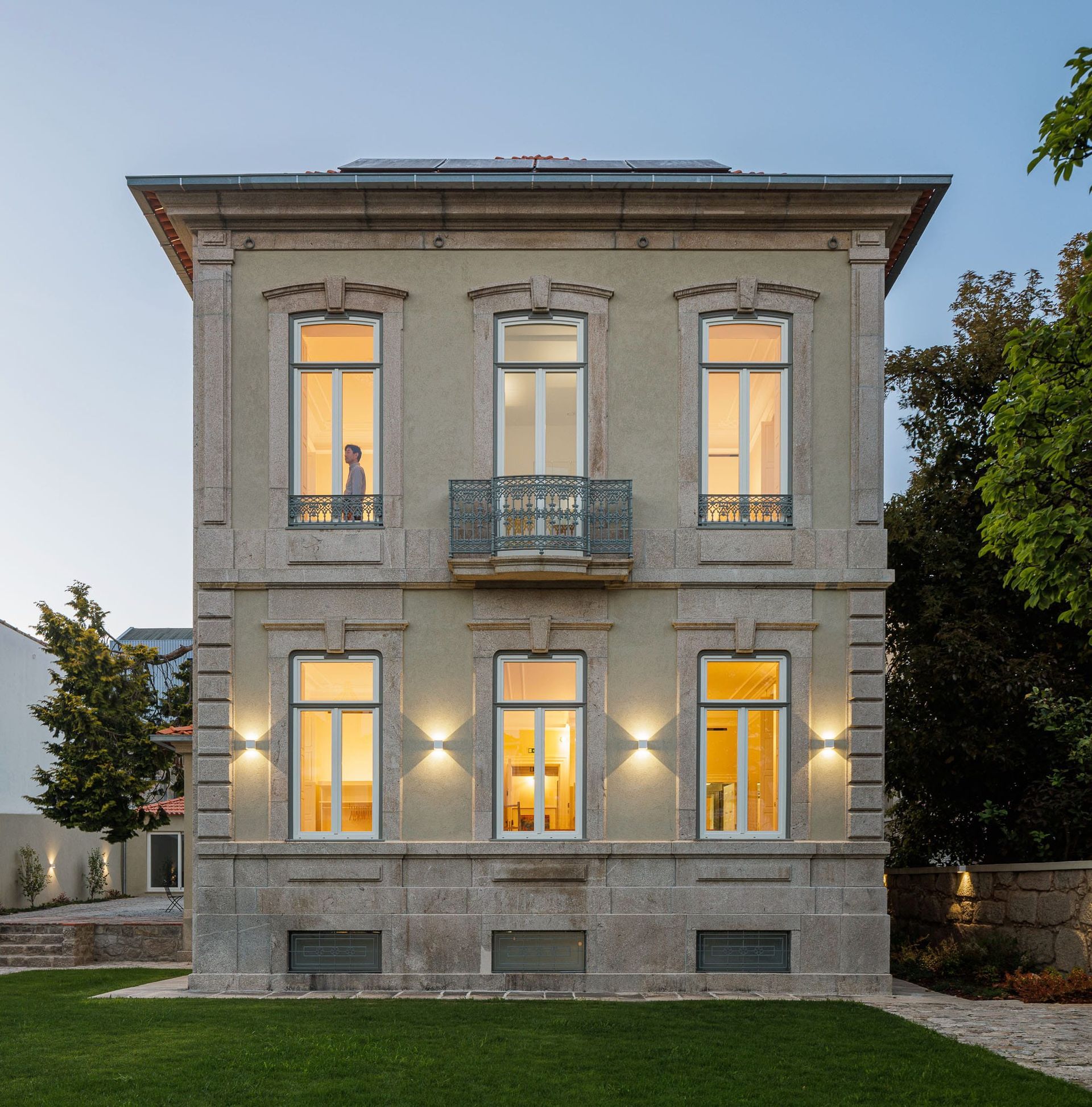 Facade of Casa Kala  in Porto, surrounded by private garden. Designed by Januário Godinho, renovated by Ren Ito Arq.