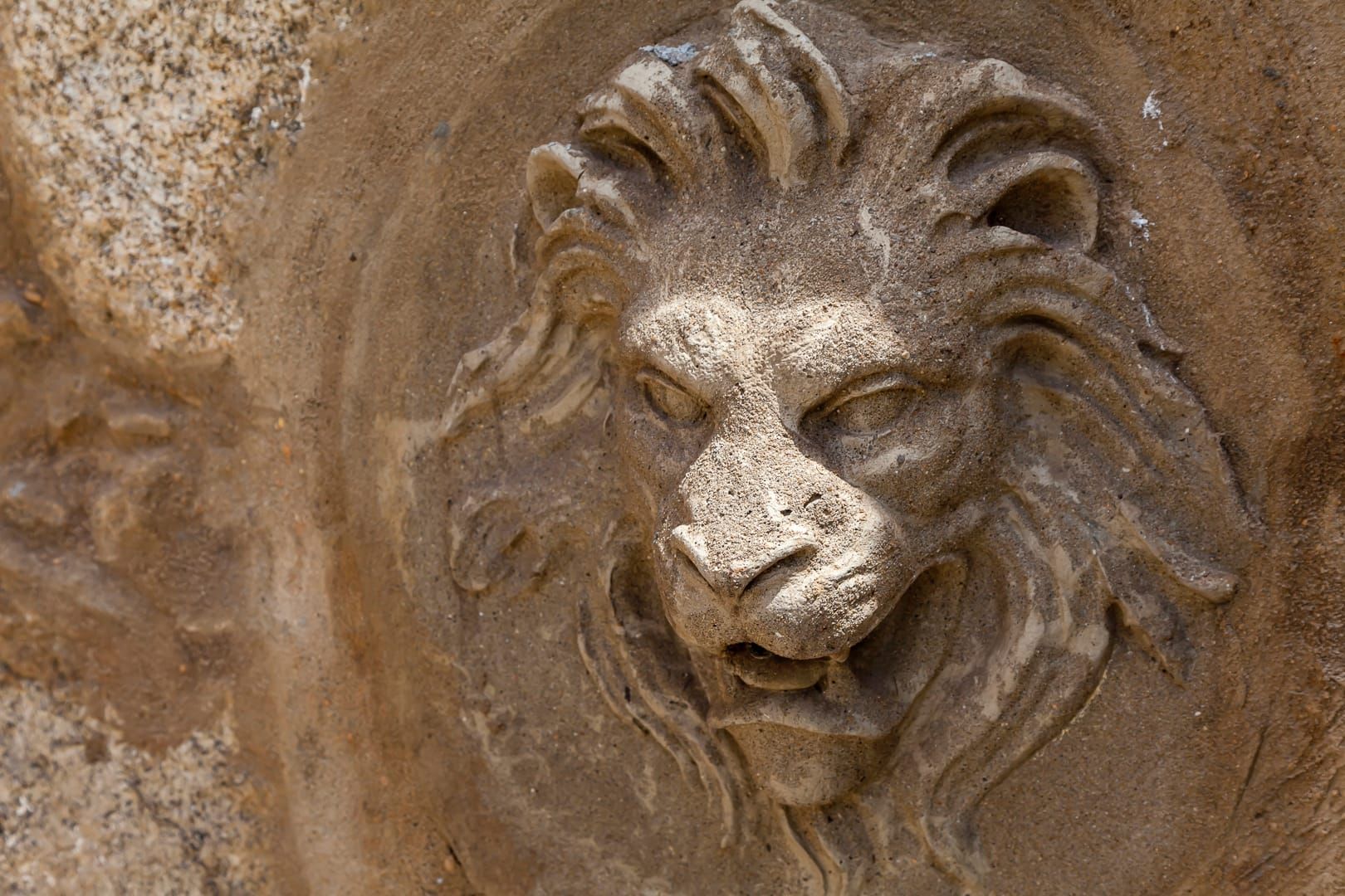 stone fountain detail in the garden
