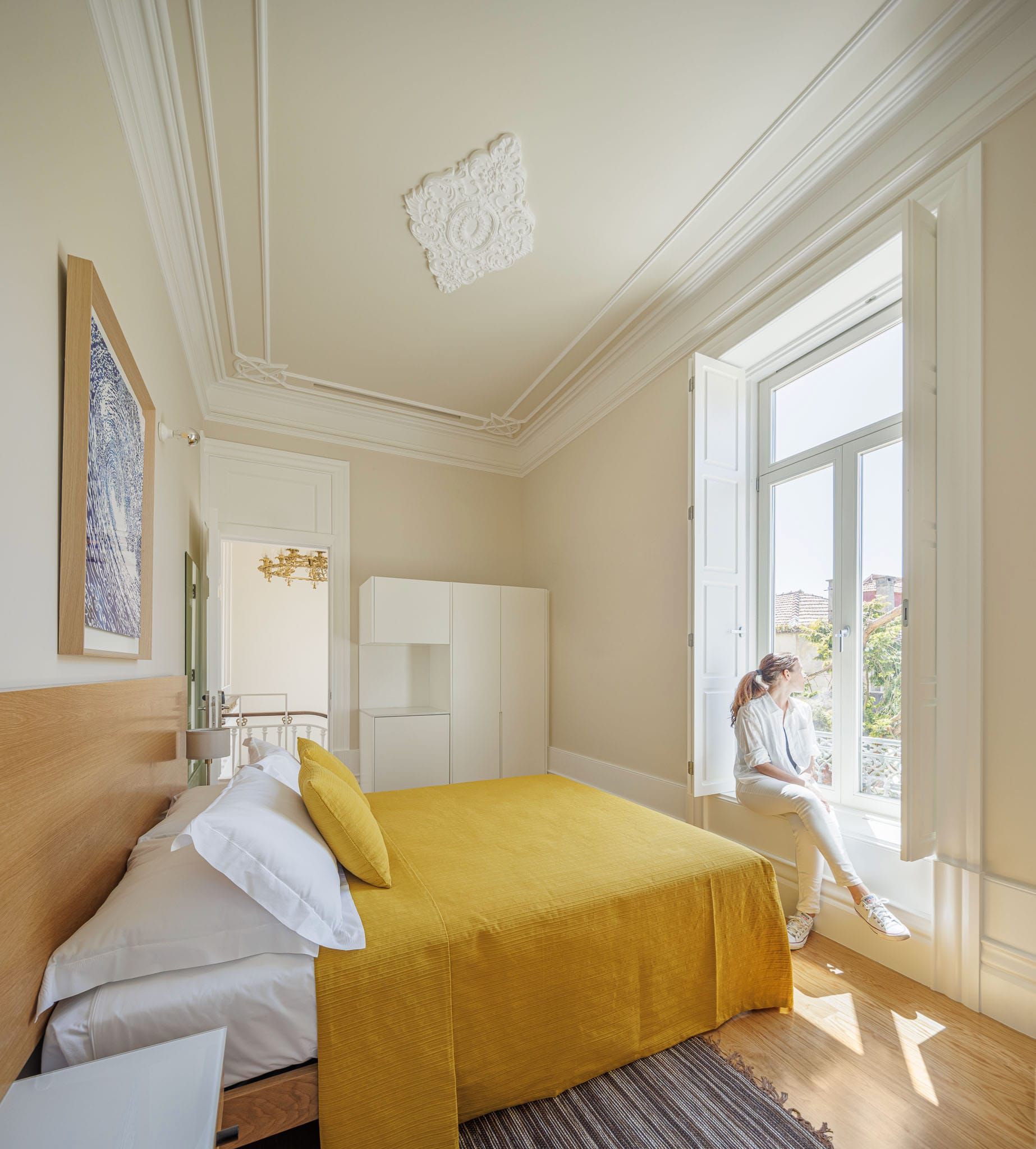 Double Room at Casa Kala, Unique Boutique Guesthouse in Porto, Portugal. Big windows provide natural light and heigh ceilings