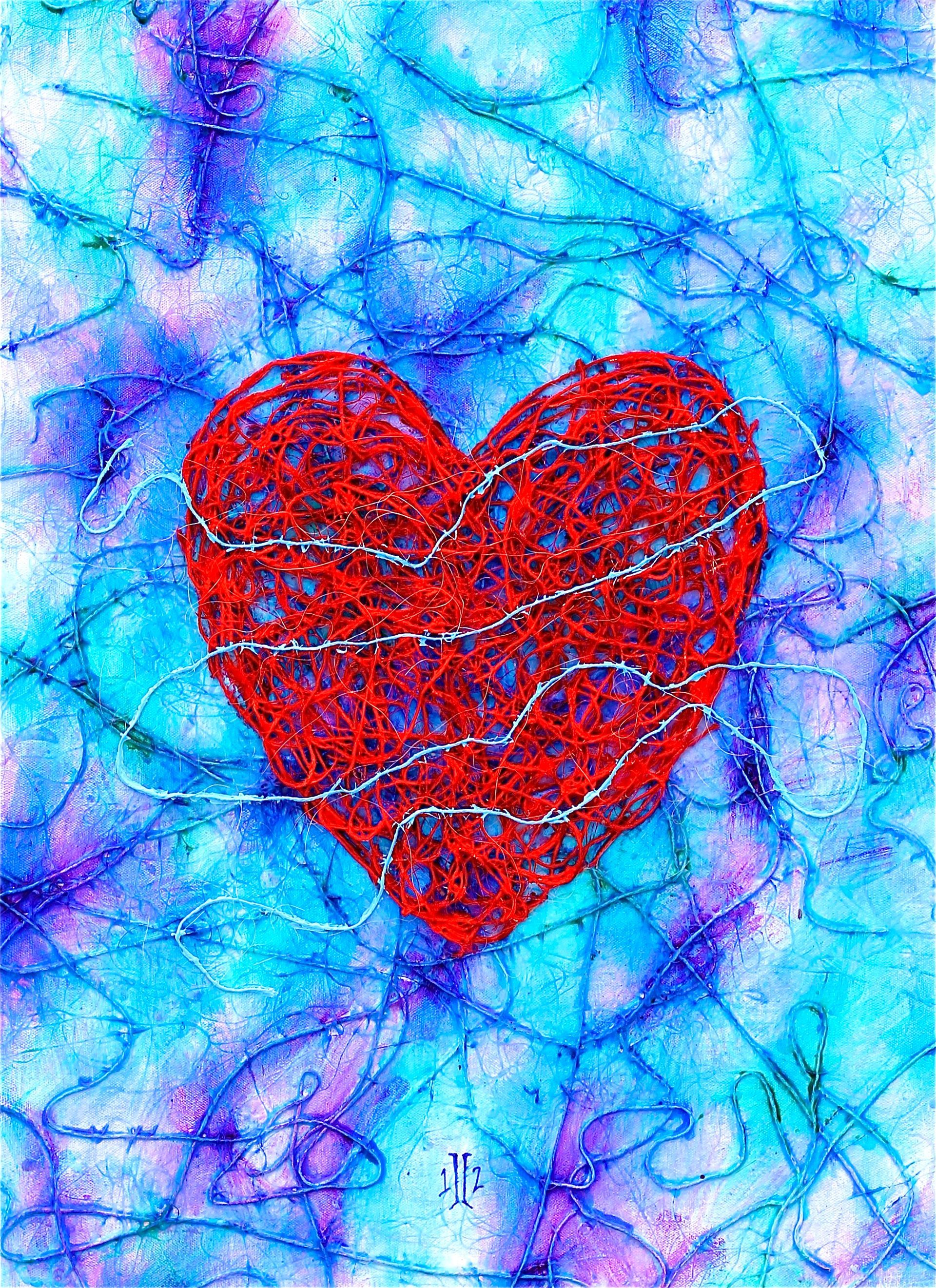 Red heart on a blue abstract textured background.