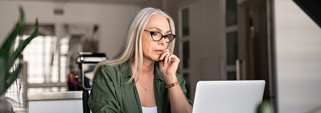 Two colleagues in an office looking at the camera