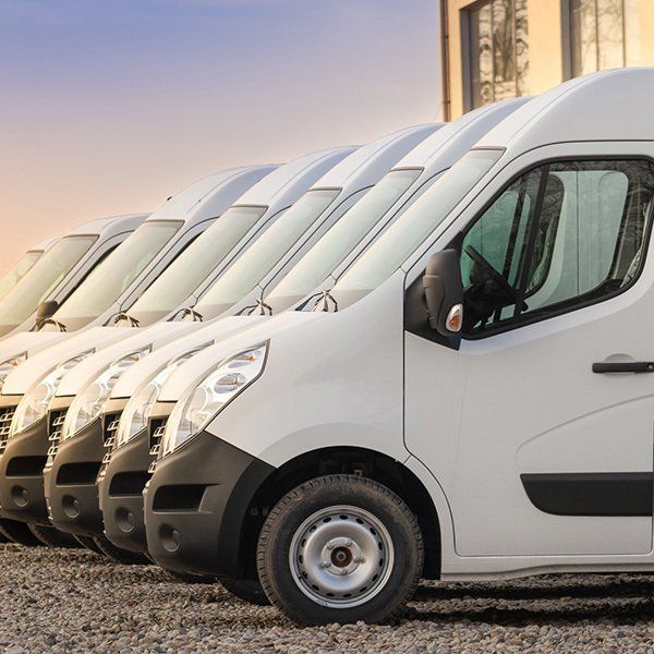 White transit vans in a line