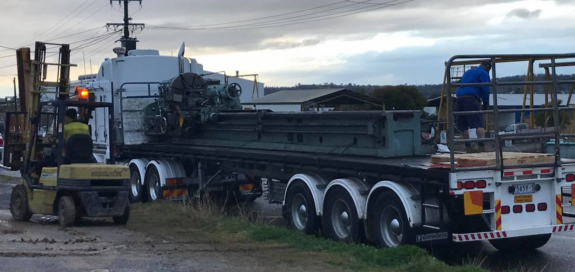 Man Driving Forklift And Truck With Heavy Machine — Engineering in Tamworth, NSW