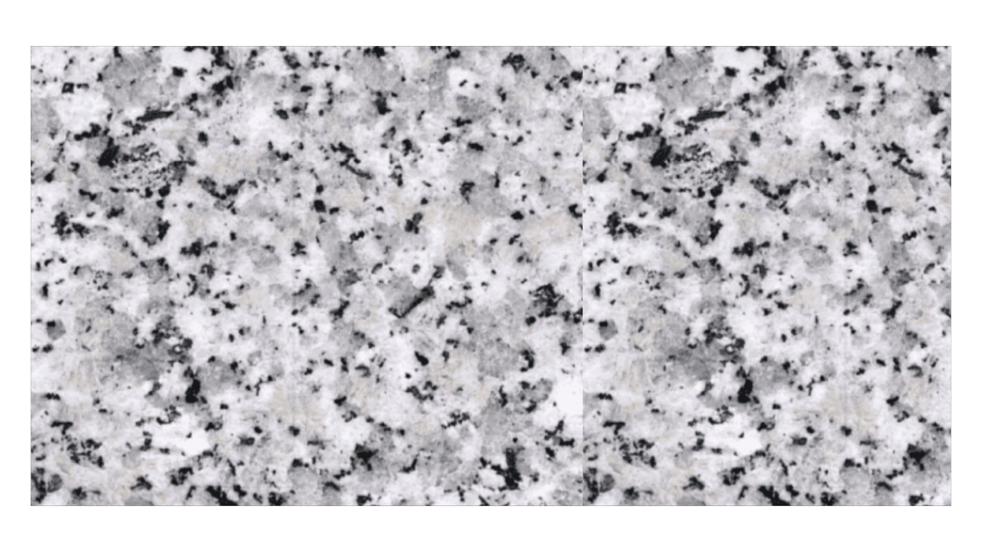 A close-up view of light gray granite stone with a speckled pattern of black, white, and gray mineral deposits.