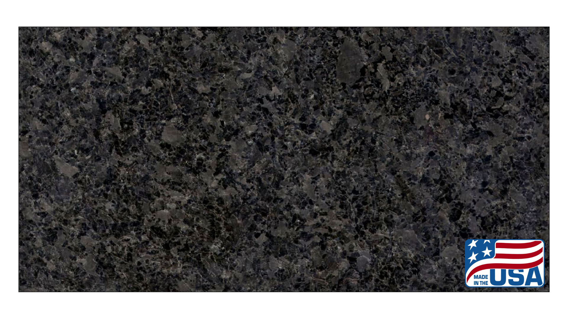 A dark charcoal-grey granite slab with fine, speckled mineral grains and a small USA flag emblem in the bottom corner.