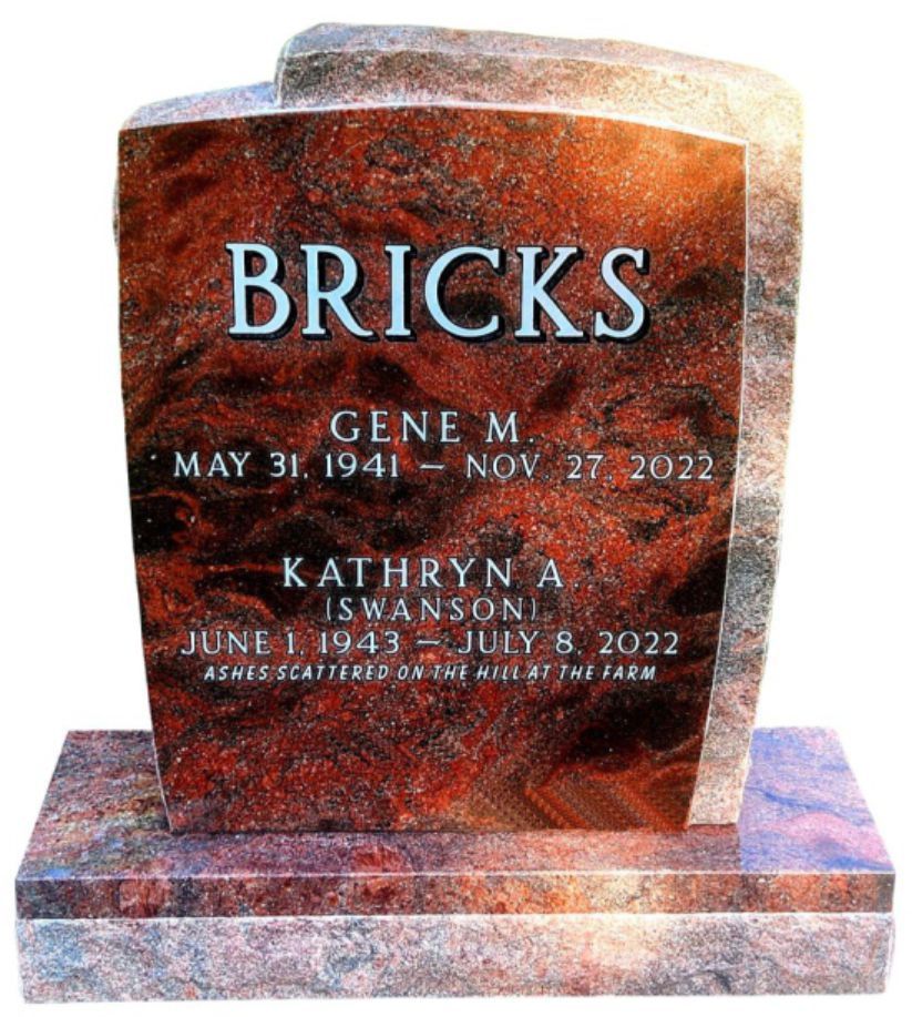 Gray stone tombstone with family name