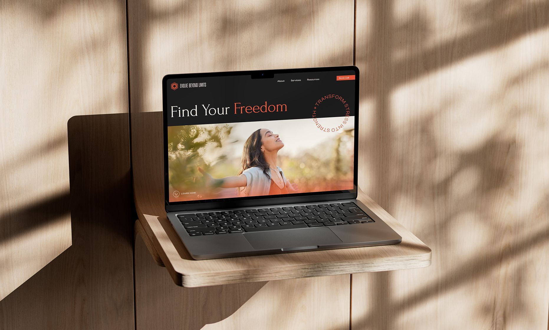 Evolve Beyond Limits website homepage design on laptop