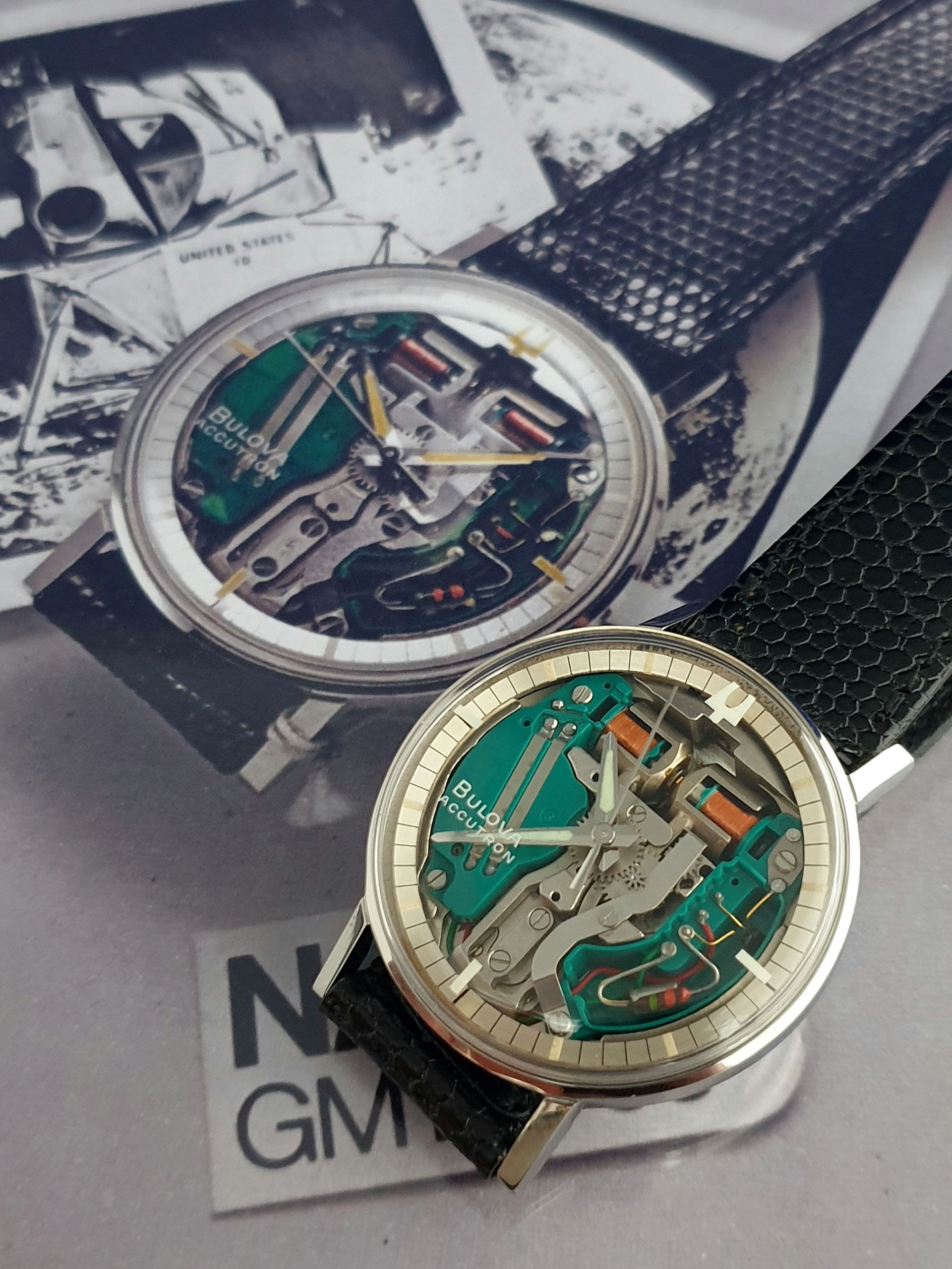 Two skeleton wristwatches, one teal and one gray, displayed on a magazine page.